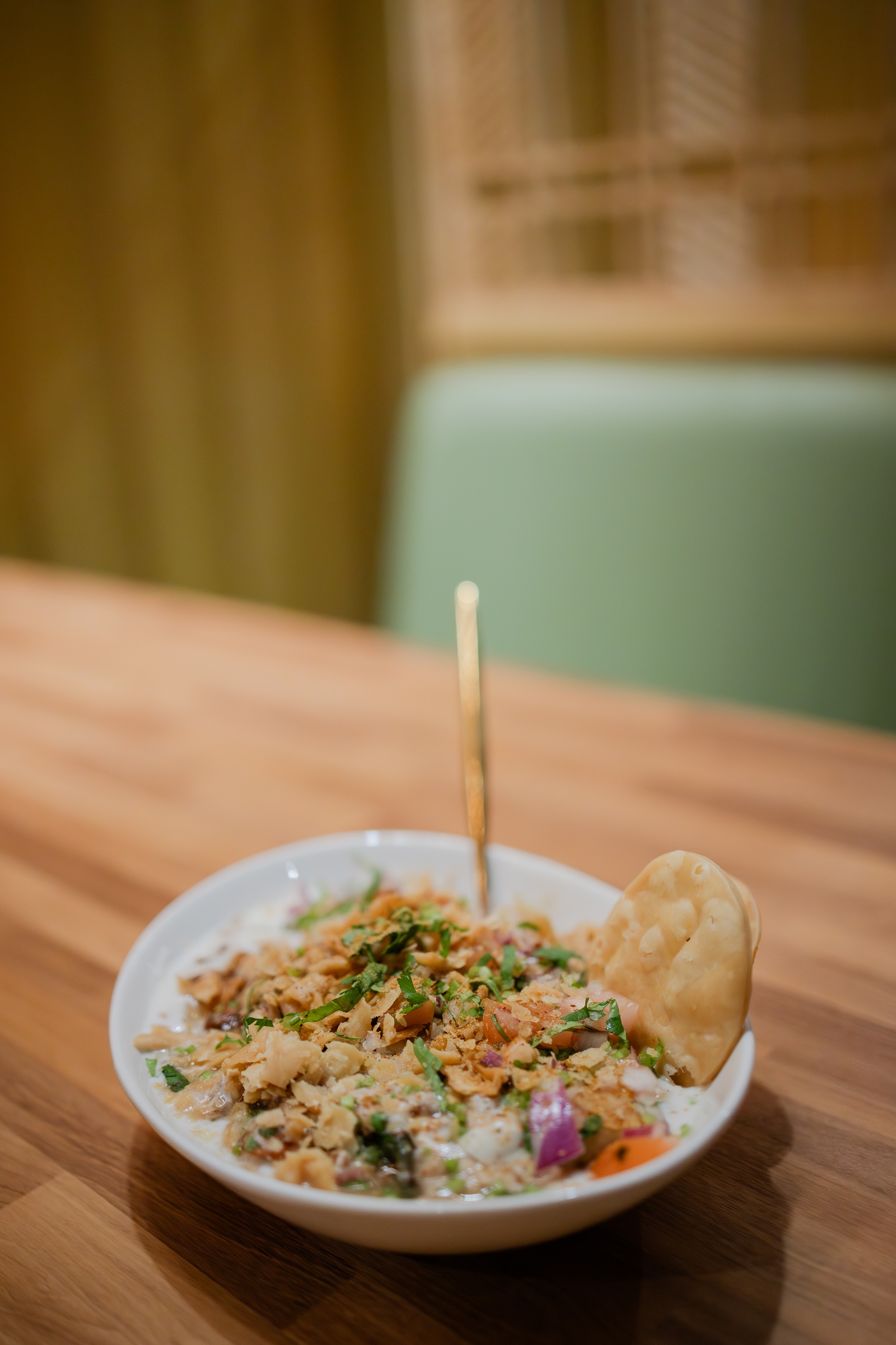 Dahi baray chaat topped with papri